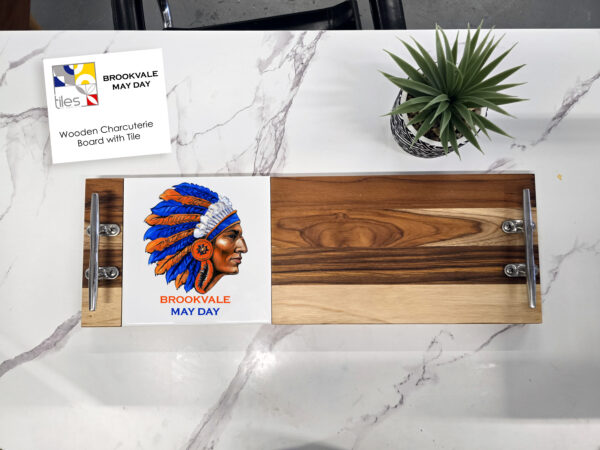 6.5” x 25” wooden board with two steel handles with a 6”x 6” tile insert